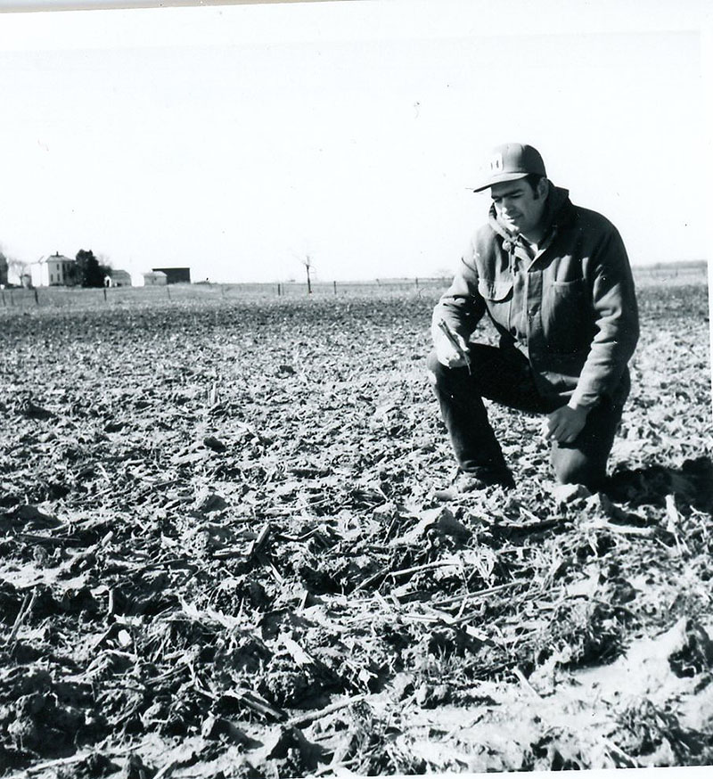 March 22, 1976
Ron VanAnsdale examines a chisel plowed field
Photo ID#: A333