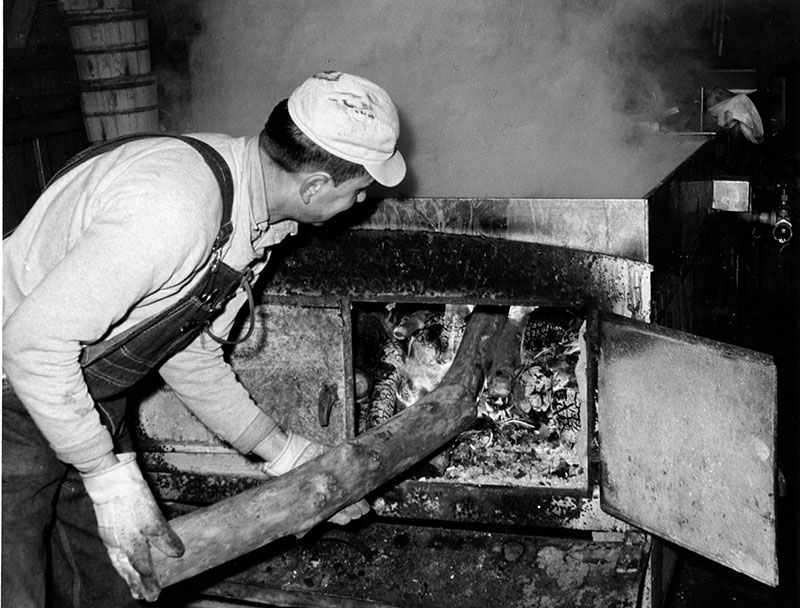 March 30, 1965
Dave Culler tending to wood stove
Photo ID#: A568