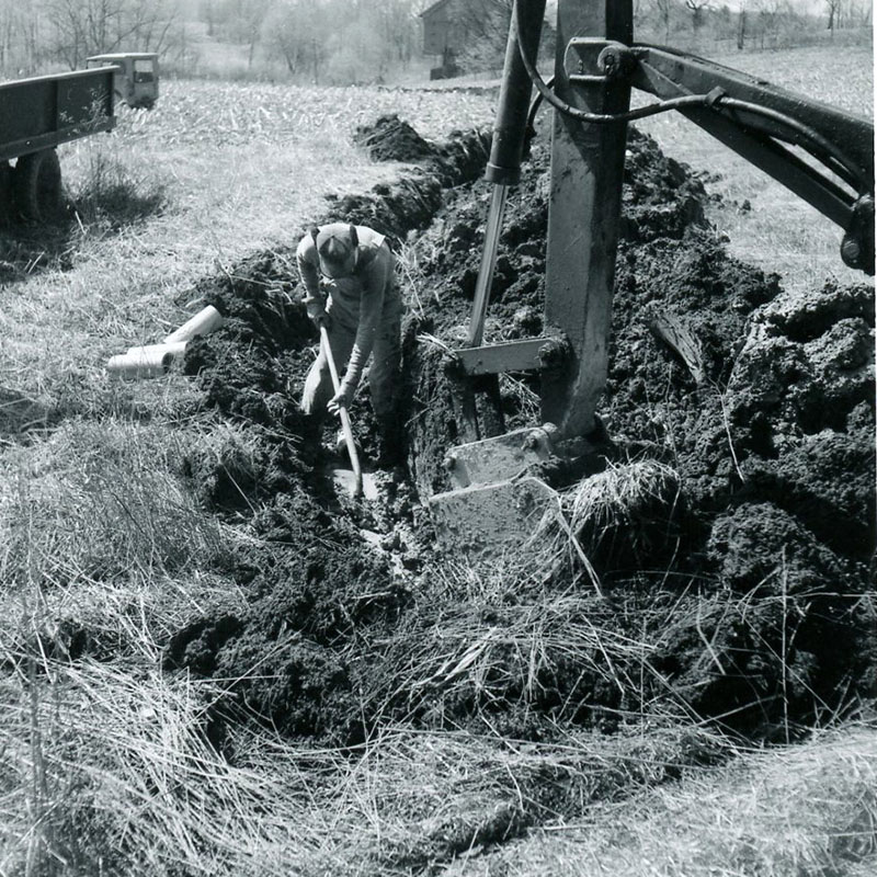 April 19, 1967
John Phillips installing drain tile at Chester Hampton's Farm 
Photo ID#: A706