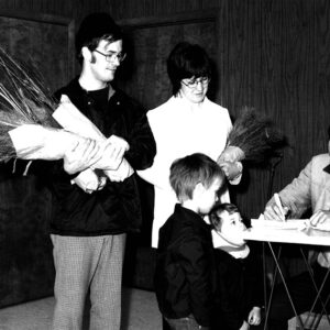 04_19_1975_Mr._and_Mrs._Jerry_Rondy___Rick___Brad_pick_up_wildlife_packets_at_the_Ag_Center_from_J._Van_Loon_website-4522
