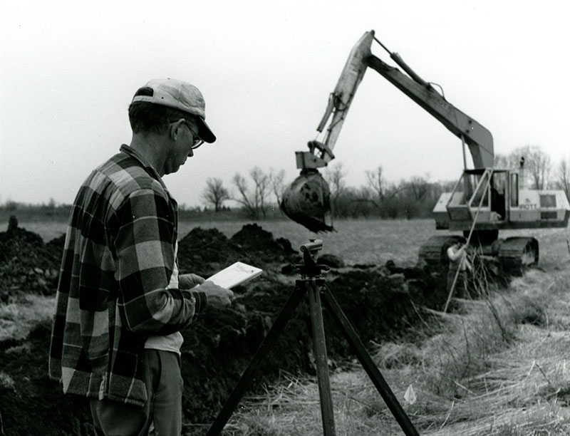 April 30, 1975
Don Shawk shown as he checked the grid for the contractor, Doug Smith, who constructed the new ditch
Photo ID#: A99