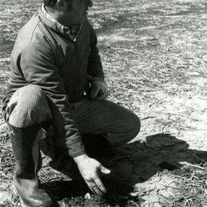 05_12_1981_Darrell_Kissell_checks_no_till_soil_condition._Kissell_Farms._Weller_Twp_website-5226