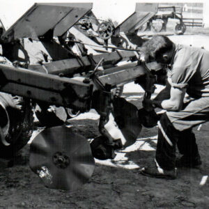 05_24_1972_Richard_Forbes_replaces_the_worn_fluted_coulter_on_the_4_row_A_C_no_till_planter_4website0001-2309