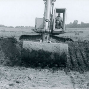 06_00_1981_Rock_lined_waterway._Doug_Smith_works_with_shovel_to_form_waterway_on_Donnersbach_farm_website-5249
