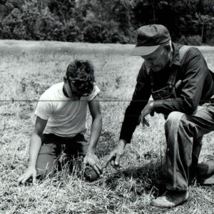06_12_1972_Gary_Forbes__grandson__with_Clarence_Forbes_examine_the_frost_damaged_no_till_farm_frosted_31___website___Copy-1170