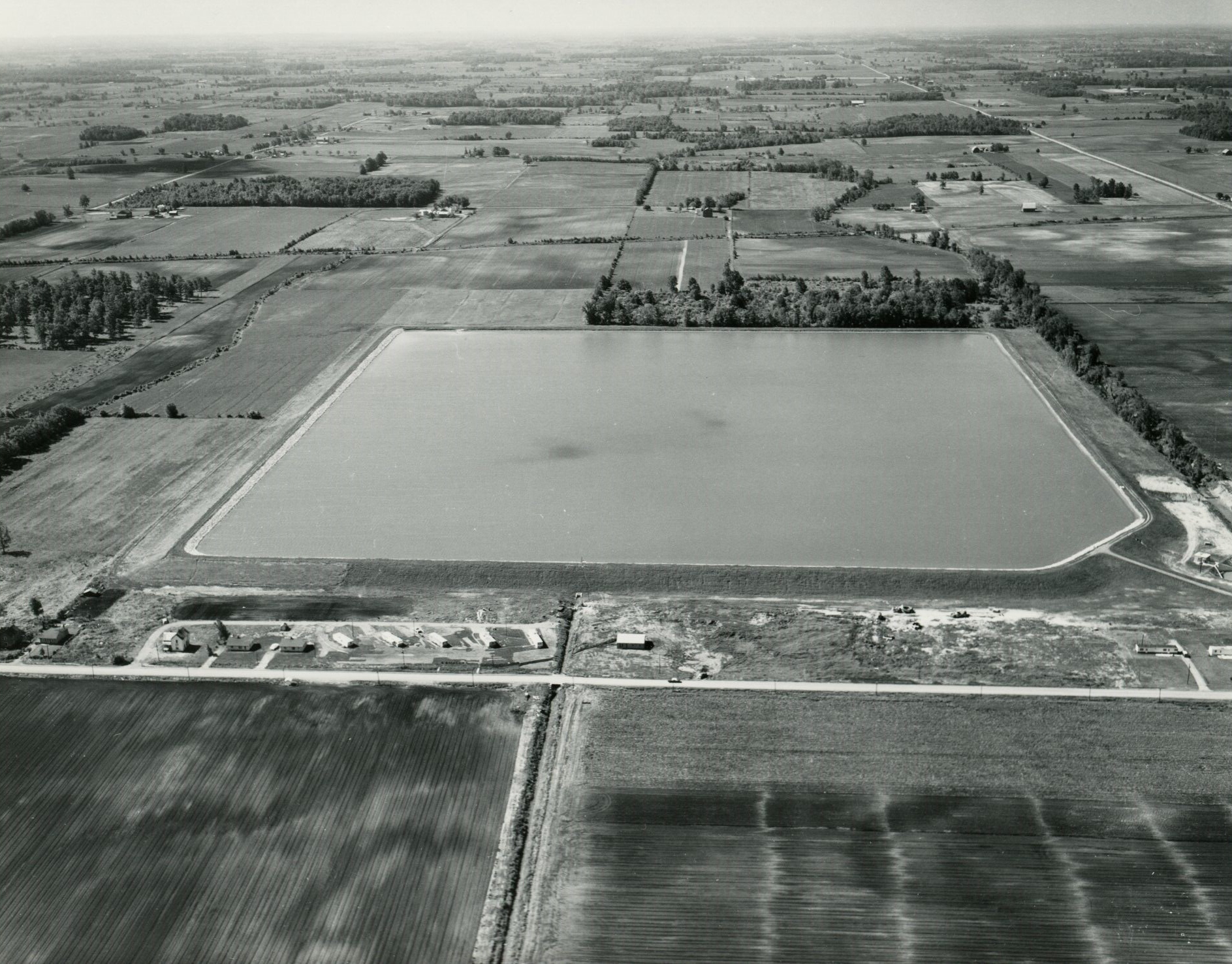 June 15, 1966
Aerial view of the 73 acre irrigation reservoir in the Marsh Run Project used for irrigating vegetable crops
Photo ID#: W2