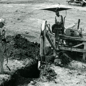 07_07_1970_Contractor_John_Phillips___son_shown_as_a_old_tile_drain_in_the_waterway_is_connected_into_the_new_line_on_the_John_Simmons__website-1292