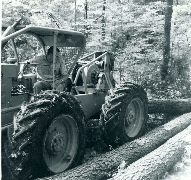 July 13, 1964
Man in tractor picking up logs
Photo ID#: S751