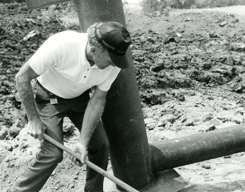 July 17, 1975
George Smith preparing pipe for placement at the Bill Evans' Farm
Photo ID#: S300