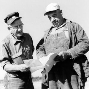 08_10_1972_William_Enderby__Farm_owner____William_Myers__contracter__examine_the_SCS_plan_for_a_pond_under_construction_website-4065