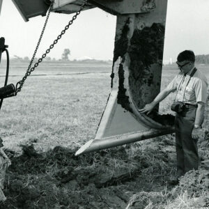 08_22_1971_Deming_Seymour__County_4_H_Agent_at_the_Farm_Science_Review._Laser_beam_directed_tubing_ditcher_website-1330
