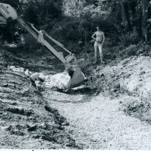 09_05_1980_Contractor_placing_oversized_riprap_along_sides_for_greater_protection._Bedding_in_bottom_of_waterway_website-5257