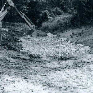 09_05_1980_Contractor_using_back_hoe_to_tamp_rip_rap_into_place._S._Carpenter_waterway_website-5259