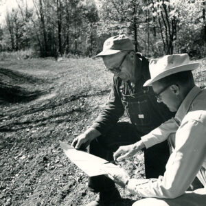 10_01_1963__LtoR__George_Spoerr_of_Butler_Twp_and_Dean_Swigert__SCS_Conservation_Technician_as_they_review_engineering_plans_for_the_newly_completed_outlet_ditch_website-509