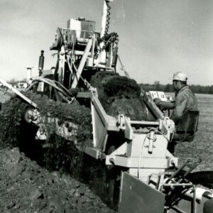 11_00_1978_Wheel_ditching_machine_with_LASER_set_up_in_Pewano_silt_loam.__Installing_clay_tile_website-630