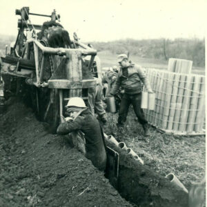 12_16_1965_2_men_with_mechanical_digger_and_drainage_tile_website-1353