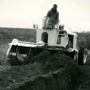 12_16_1965_Ed_Allgire__tile_drainage_contractor__covering_the_ditches_at_the_Mrs._Nina_Reed_Farm_website-1356
