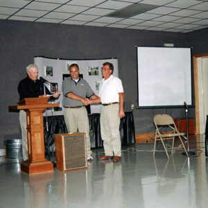 2000_Annual_Meeting_Lavaughn_Oswalt___George_Fackler_present_to_Jerry_Schumacher_website-3628