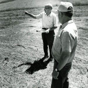 Foreground___George_Eschman_contractor._Other_gentleman_is_County_Agent_Bob_Mills_website-2669