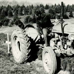 Man_on_tractor_digging_trench_with_tractor_to_plant_trees_website-2831