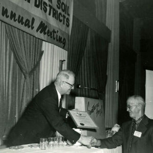 Unidentified_man_making_a_presentation_at_an_annual_meeting_website-3716